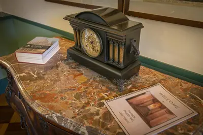 a clock sitting on top of a table at Pantheon Palazzo Nari Terrace #12 in Rome