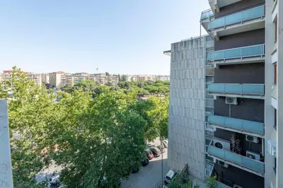 an apartment building with a view of a city at San Paolo Home in Rome