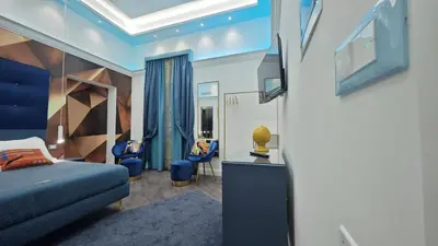 a hotel room with a bed and a tv at Antiqua Domus in Rome