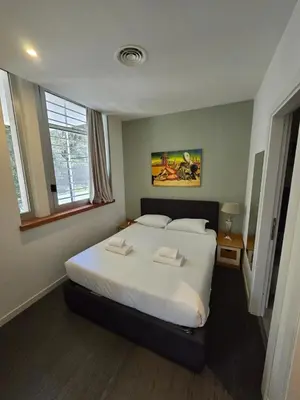 a bedroom with a bed with two towels on it at Apartment Villa Borghese with terrace in Rome