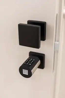 a tv and a remote control on a wall at Sistina Boutique Guest House in Rome