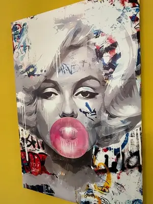a painting of a woman with a pink tongue at La Casa di Rosa , Elegante Appartamento a Corso Trieste, Metro B in Rome