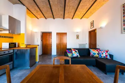 a living room with a couch and a table at Casa Bodoni in Rome