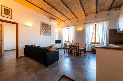 a living room with a couch and a table at Casa Bodoni in Rome