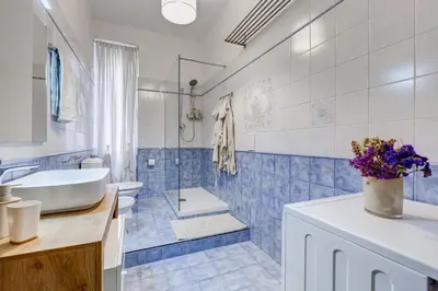 a bathroom with a sink and a toilet and a tub at Apartment Atelier Testaccio in Rome