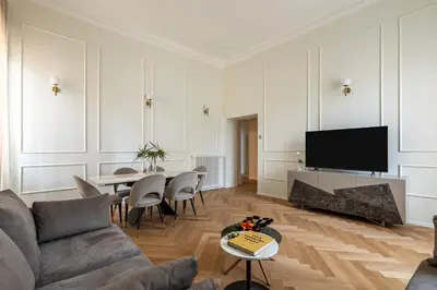 a living room with a couch and a table at SJR Luxury Apartment Trevi Fountain in Rome