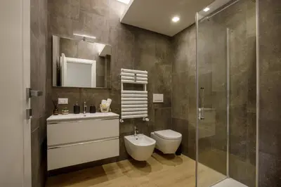 a bathroom with a toilet and a sink and a shower at Pio Vatican Flat in Rome