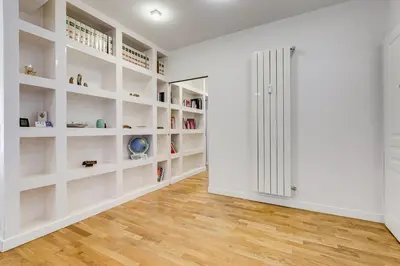 a room with white shelves and a closet at Valle Aurelia Vatican Home - Beutiful View & Wi-Fi in Rome