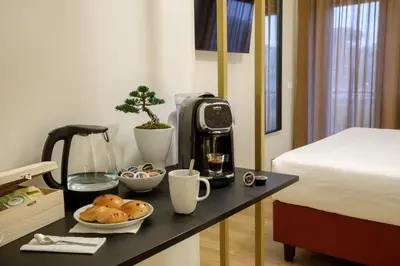 a bathroom with a toilet and a black counter at Suites 51 in Rome