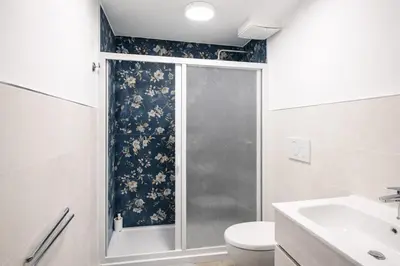 a bathroom with a shower and a toilet and a sink at Central Rome 2BR Walk to Vatican & Piazza Navona in Rome