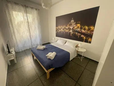 a bedroom with a bed with two towels on it at Morosini House Rome in Rome