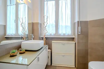 a bathroom with a sink and a mirror at D'Aquino Apartment St. Peter's in Rome