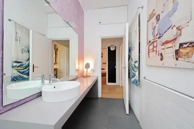 a bathroom with a white sink and a mirror at San Pietro Al Vaticano by Halldis in Rome