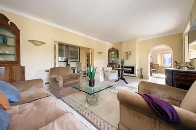 a living room with two couches and a table at Colosseo Way in Rome