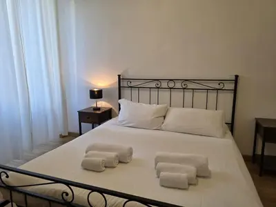 a bedroom with a bed with two towels on it at Be Your Home - MR House in Rome