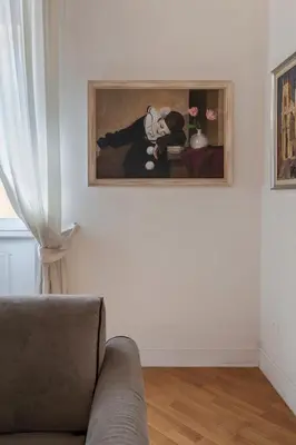 a living room with a couch and a painting on the wall at Star Beauty House in Rome