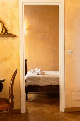 a bedroom with a large television on the wall at SorinaHome Campo de Fiori Apartament in Rome