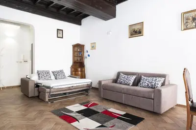 a living room with two couches and a couch at Campo de Fiori Large Family Apartment in Rome