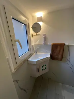 a bathroom with a sink and a window at Loft a piazza di Spagna in Rome