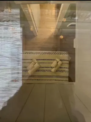 a reflection of a bathroom in a glass window at Vita lenta Roma Pigneto terrazza in Rome