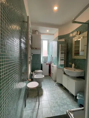 a bathroom with two sinks and two toilets at Steph and Lorenzo's place in Rome