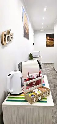 a table with a toaster and a printer on it at Dolce Titina Affittacamere in Rome