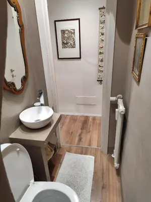 a bathroom with a toilet and a sink at Appartamento Suite Ponte Milvio in Rome