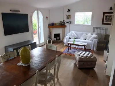 a living room with a table and a couch at Sales in Rome