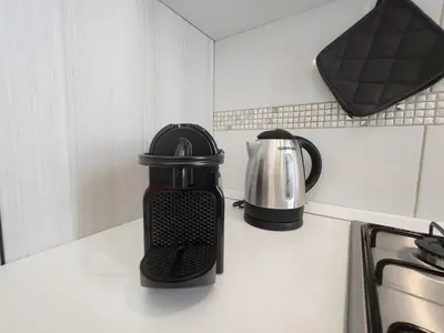 a coffee maker on a counter in a kitchen at Beatrice's House Spa Bath Privata e Parcheggio Gratuito a Roma in Rome