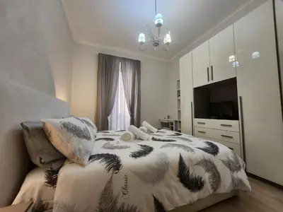 a bedroom with a bed and a television in it at Beatrice's House Spa Bath Privata e Parcheggio Gratuito a Roma in Rome