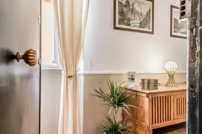 a room with a window and a table with plants at Sweet home Trastevere- Roma in Rome