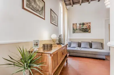 a living room with a couch and a table at Sweet home Trastevere- Roma in Rome