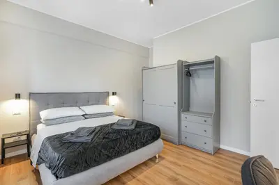 a bedroom with a large bed and a closet at Vatican - Angolo di Roma in Rome
