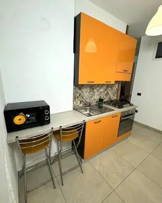 a kitchen with a stove top oven next to a sink at Wild Luxury Home in Rome