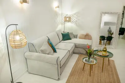 a living room with a couch and a table at Minerva boutique residence 4 in Rome