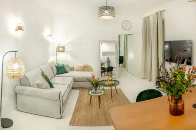 a living room with a couch and a table at Minerva boutique residence 4 in Rome