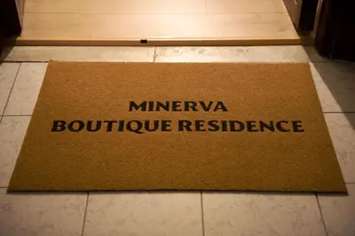 a brown welcome mat on the floor of a kitchen at Minerva boutique residence 4 in Rome