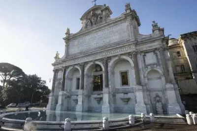 an old building with a fountain in front of it at Under Trastevere stars in Rome
