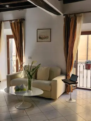 a living room with a couch and a table at Boschetto49 in Rome