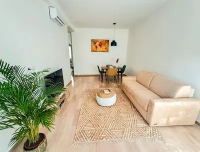 a living room with a couch and a table at ophelia apartment in Rome