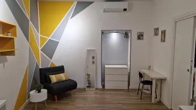 a room with a shower and a chair and a desk at Varia Domus in Rome