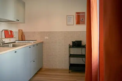 a kitchen with a sink and a counter top at Bivio - Casa Azzurra in Rome
