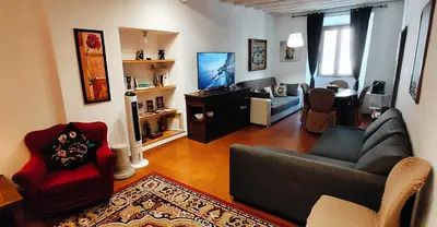 a living room with a couch and two chairs at La Torre del Moro - RH Collection in Rome