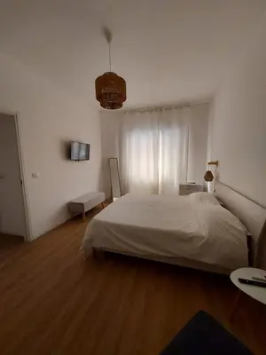 a bedroom with a large white bed in a room at Interno 4 al Vaticano in Rome