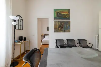 a room with a table and chairs and a bed at DOMUS GIULIA in Rome