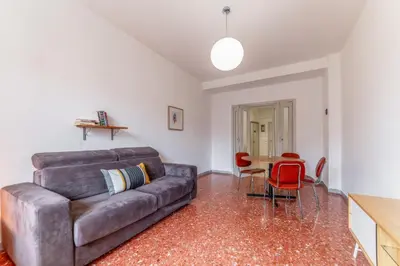 a living room with a couch and a table at Casilina Green House - Metro Malatesta & Wi-Fi in Rome