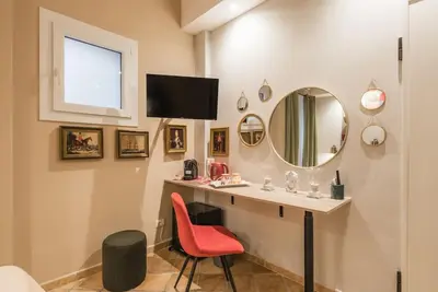 a bedroom with a bed and a colorful wall at NEW! Monti 63 in Rome