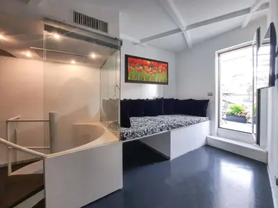 a living room with a couch and a window at Vivi la Magia di Looney Tunes, piazza navona in Rome