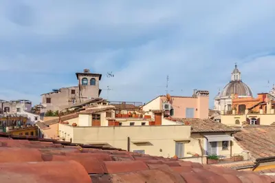 a view of roofs of buildings in a city at Vivi la Magia di Looney Tunes, piazza navona in Rome