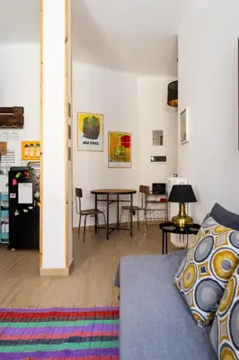 a living room with a couch and a table at La Dolce Vita - Testaccio Authentic District 2 in Rome
